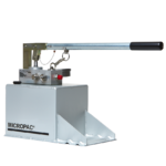 a hydraulic hand pump on top of a fluid reservoir