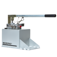 a hydraulic hand pump on top of a fluid reservoir