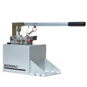 a hydraulic hand pump on top of a fluid reservoir