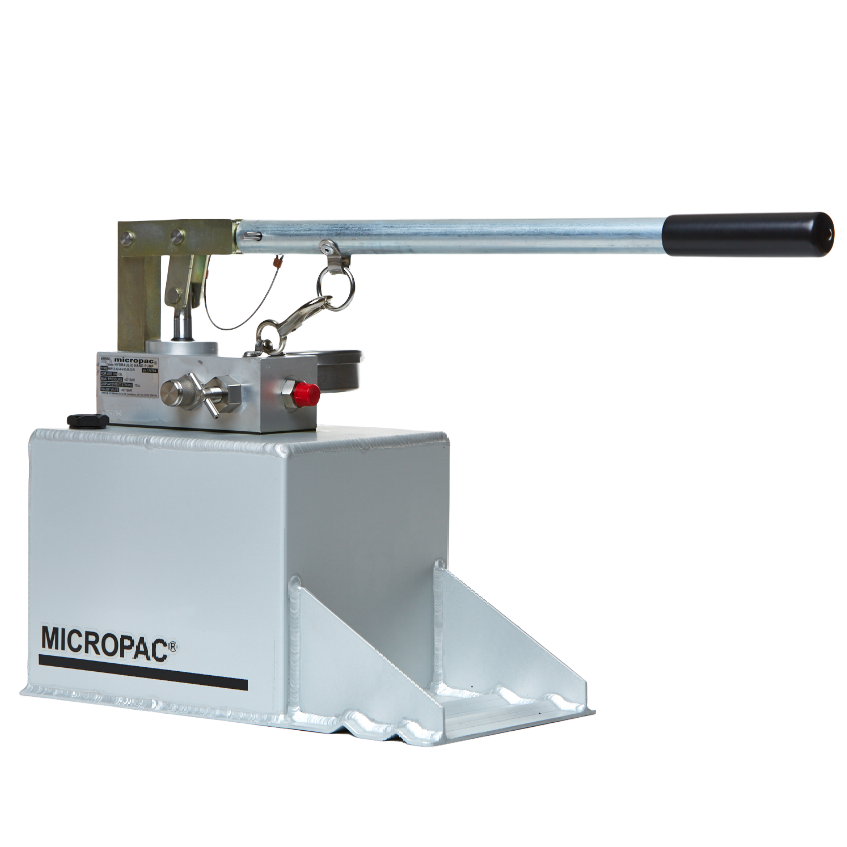 a hydraulic hand pump on top of a fluid reservoir