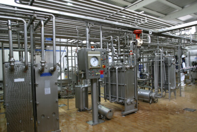 industrial pipework and valves shown in a factory