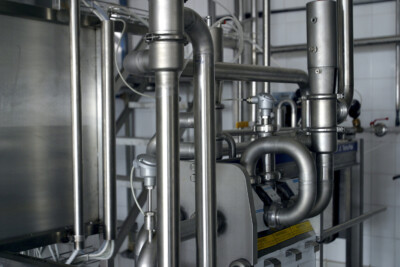 industrial pipework and valves shown in a factory