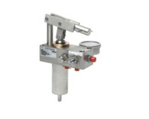 A stainless steel 316 hand pump with a rectangular body, cylindrical barrel underneath and a hand mechanism above