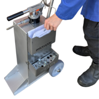 user putting some documents into the handy document storage tray on the side of our hydraulic service cart