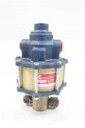 a typical air driven pump air driven pump with a cylindrical body, a fluid pump section below with check valves either side then the pneumatic valve section on top with its air and exhaust ports.