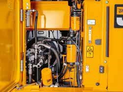 hydraulic pipework and power pack on JCB 131X Excavator. Yellow fluid reservoir, filters and joining hoses.
