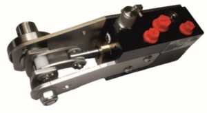 a micropac panel pump with the handle shaft and valve on the far side then the mechanism and pump body facing us for mounting inside a reservoir