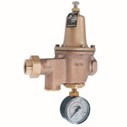 A high performance but low cost water pressure reducing valve a streamlined brass cast valve body with a dome above it, ports on either end and a pressure gauge below